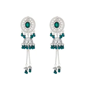 Close-up detail of exotic green beaded jhumka earrings featuring intricate filigree work.