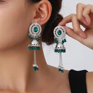 Exquisite exotic hollow disk drop earrings with green beads and rhinestones detail view.