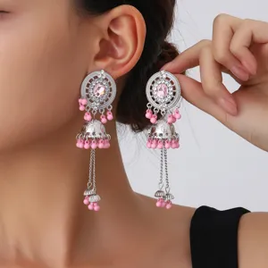 Exquisite silver tone jhumka earrings with pink beads and sparkly rhinestones for daily wear.