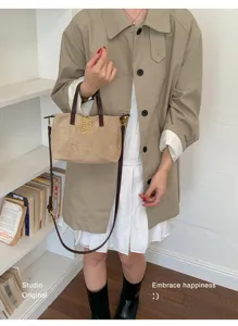 Stylish suede crossbody bucket bag with chain detail, trendy women shoulder bag for autumn.