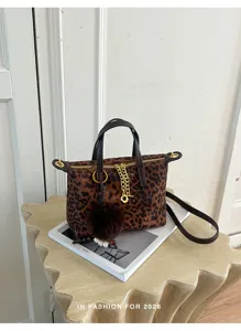 Leopard print handbag with top handle, chic chain decor and pom-pom pendant for women.