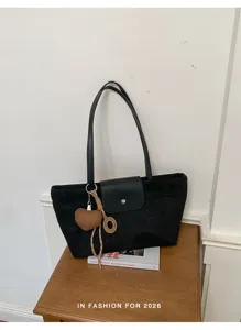 Black suede tote bag for women, large capacity shoulder bag with flap closure and cute heart charm.