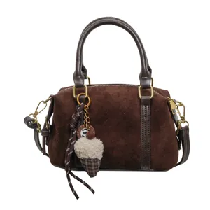 Retro brown suede women handbag, chic niche design small crossbody Boston bag with cute plush pendant.
