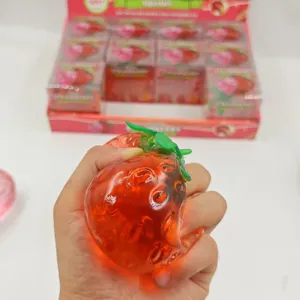 Translucent red strawberry squishy toy, soft stress relief toy with gel filling for fun.