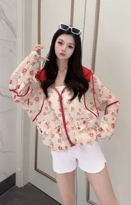 Summer floral sun protection hooded lightweight jacket details showing casual loose fit top.
