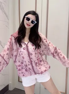 Detailed view of lightweight pink floral zip-up hoodie sun protection jacket for women