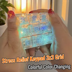 Transparent 3x3 mechanical keyboard fidget toy with colorful LED lights keychain pendant.