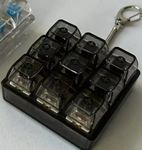 Mechanical keyboard switch fidget toy keychain 9 keys stress relief gadget detail shot.