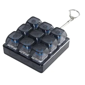 Mechanical keyboard 9-key fidget toy keychain, stress relief switch clicker with metal ring.