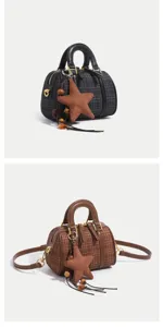 Detailed view of the autumn winter classic Boston pillow bag with stylish plaid pattern and star charm.