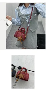 Detailed shot of the autumn red plaid Boston handbag featuring a cute star charm and crossbody strap.