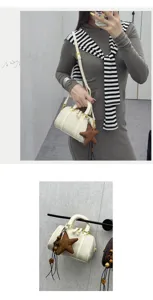 Detailed view of autumn winter plaid Boston handbag featuring star pendant and gold tone hardware.