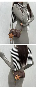 Detailed view of the stylish brown plaid Boston crossbody bag with star charm and chic design.
