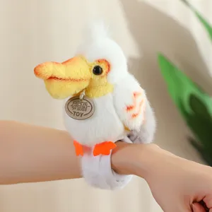 Adorable bird plush slap bracelet toy detail view, soft stuffed wristband accessory.