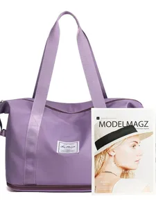 Detail view of the purple travel duffel bag with durable handles and bottom zipper compartment.
