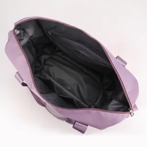 Spacious purple travel duffel bag with zipper closure and interior pockets for gym use.