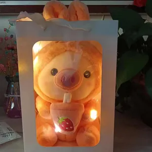 Detailed view of the cute transforming boba tea pig rabbit plush doll in gift box, soft toy.