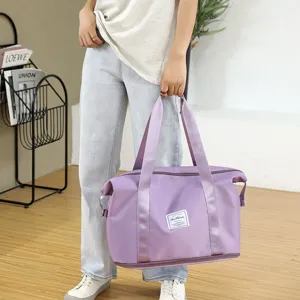Large capacity purple travel duffel bag with bottom zipper expansion and sturdy handles for gym.