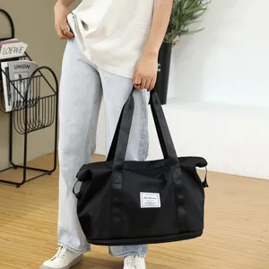 Large capacity black travel fitness bag, foldable handbag with sturdy straps for outdoor use.