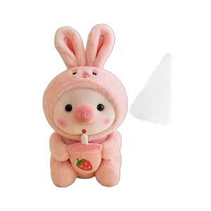 Cute pink bunny pig plush toy holding a strawberry boba tea. Soft stuffed doll for kids.