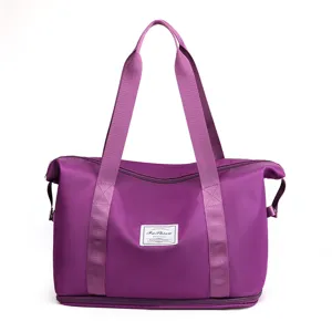 Purple travel duffel bag with handles and bottom storage layer for fitness and outdoor trips.