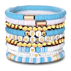 Stapelbare Game Day Tonperlen Armbänder Set mit blau weiß und gold Metall Akzentperlen.