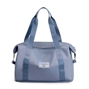 Blue travel duffel bag foldable gym bag waterproof overnight bag with sturdy handles.