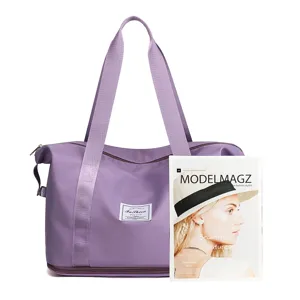 Foldable travel duffel bag with sturdy handles and convenient pockets for gym and sports