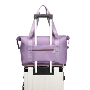 Foldable travel duffel bag with luggage sleeve in purple, lightweight flight carry on bag.