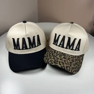 Detailed showcase of embroidered MAMA baseball caps featuring classic and leopard print brims.
