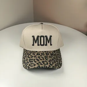 Classic beige dad hat featuring bold black MOM embroidery and a stylish leopard print brim.