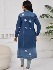 Women long denim trench coat back view showing distressed ripped details and raw hem.