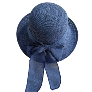 Chapeau de paille tissé bleu marine pour femmes avec grand nœud, large bord anti-soleil.