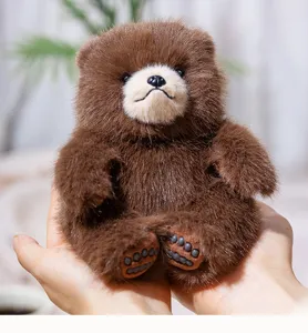 Cute chubby brown bear plush toy, soft stuffed animal doll for children and home decor.