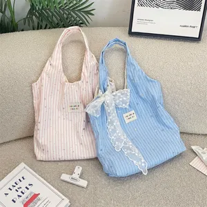 Ins style canvas tote bag with cute star pattern, stylish casual shoulder bag for women.