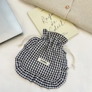 Black and white gingham drawstring pouch detail with cute ruffles and Sozakka label.
