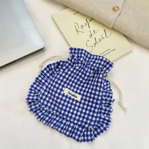 Blue white gingham drawstring pouch detail shot, sweet ruffle storage bag for small items.