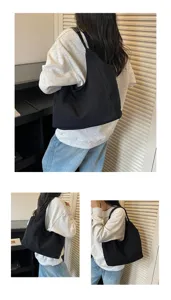 Detailansicht der schwarzen Canvas Schultertasche mit Seiten- und Rückentrageoptik.