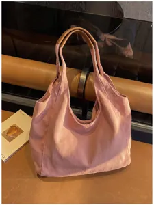 Stilvolle rosa Canvas Umhängetasche mit braunen Griffen, lässiger Shopper für Damen Alltag.