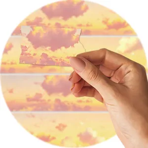 Détail de ruban adhésif Washi nuages de coucher de soleil, décor paysage orange chaud pour journal.
