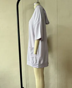 Casual loose hooded sweatshirt dress with short sleeves and pockets, side view detail shot.
