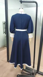 Back detail of dark blue midi dress featuring elegant white contrast collar cuffs and belt.
