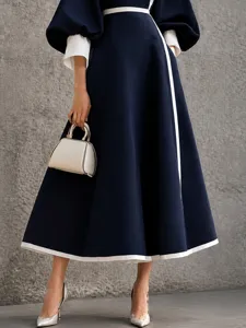 Elegant dark blue midi dress with color-block lantern sleeves and slim waist for women chic daily.