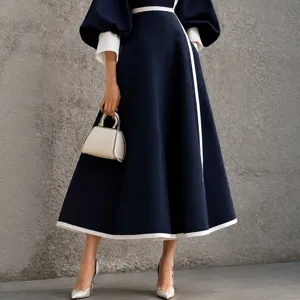 Elegant navy blue colorblock midi dress with bishop sleeves and white trim for women.