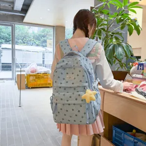 Sac à dos étudiant style doux avec motif étoile et pendentif mignon pour voyage et quotidien.