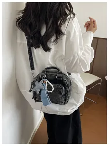 Korean style niche denim crossbody bag for women, chic dark grey shoulder purse with star charm.