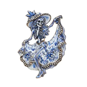 Day of the Dead dancing skeleton brooch pin with blue white floral rhinestone design.