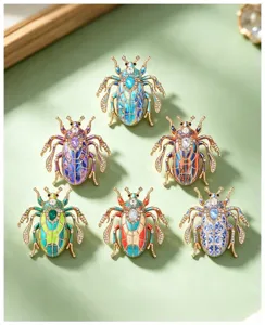 Detailed view of vintage enamel crystal beetle brooches, showcasing intricate colorful details.