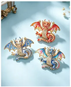 Detailed close-up of colorful crystal dragon brooches showing exquisite enamel and diamond details.