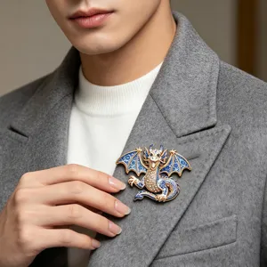 Exquisite blue and white dragon brooch with sparkling rhinestones and elegant gold trim.
